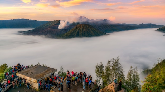 Trekker taking photo of Gunung Bromo volcano in Java, Indonesia, Sunrise 