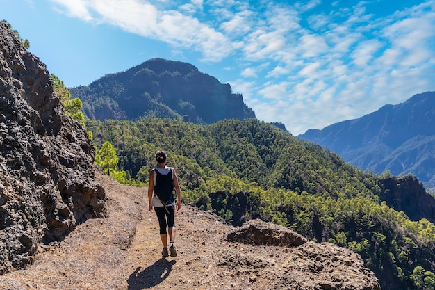 trekking on top of la cumbrecita sitting in the natural viewpoint in caldera de taburiente, la palma