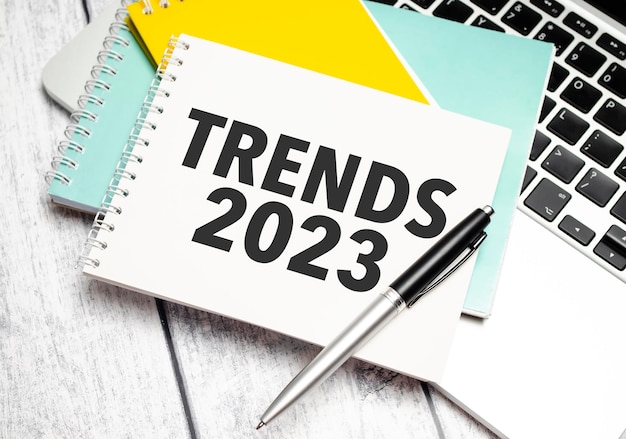 Trends 2023 Conceptual background with chart papers and pen