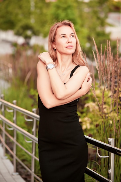 Trendy female posing in the street.