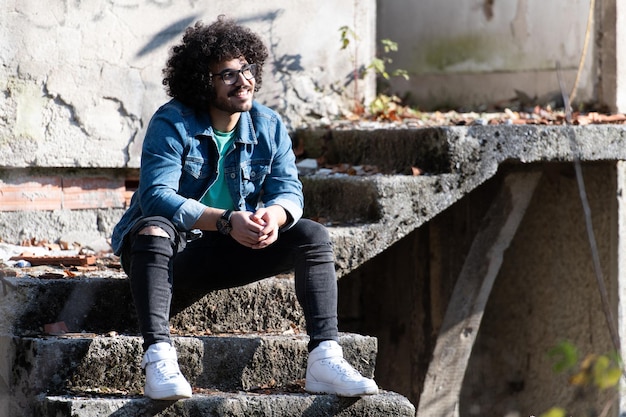 Trendy Handsome Man Posing at Ruins Ruined House