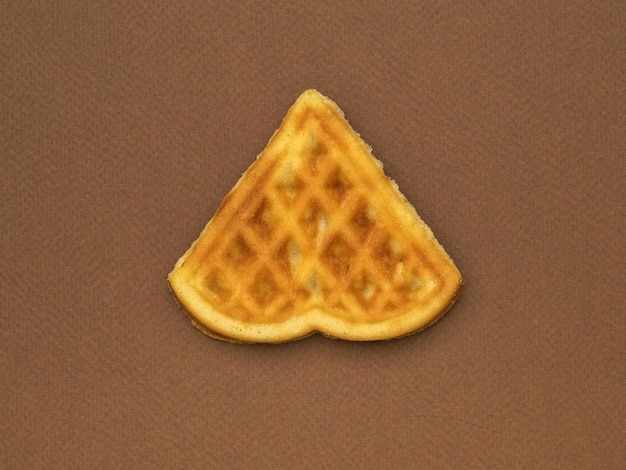 Triangular pastry on a dark brown background