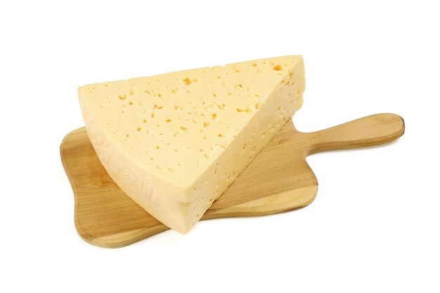 Triangular piece of cheese on cutting board, isolated on white background close-up