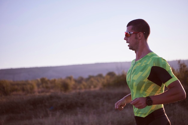 triathlon athlete running on morning trainig