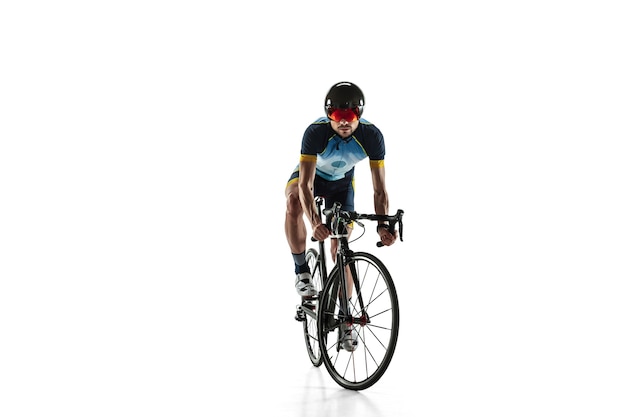 Triathlon male athlete cycle training isolated on white studio background