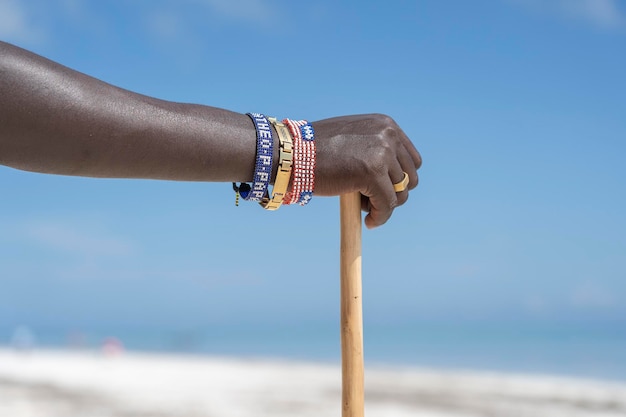 Tribal masai hand with a colorfull bracelet closeup Zanzibar Tanzania Africa