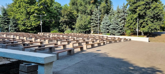 Tribunes on the street. Amphitheater. Benches in front of a street scene.