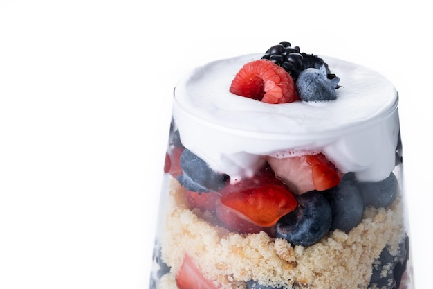 Trifle dessert with berries and cream isolated on white background