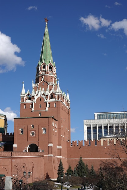 Troitskaya Tower of the Moscow Kremlin and the State Kremlin Palace on spring sunny day