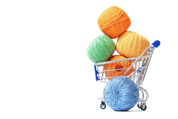 Trolley with yarn for knitting.