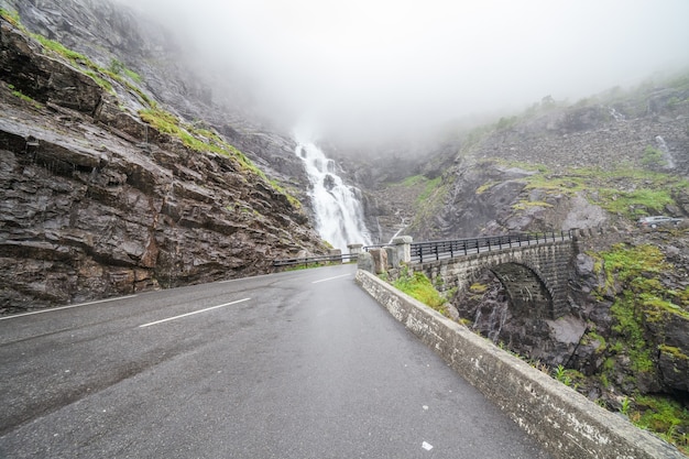 Trolls Path Trollstigen or Trollstigveien scenic mountain road in Norway Europe. Waterfall and bridge. National tourist route.