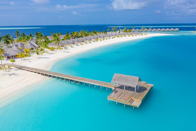 Tropical aerial landscape water villas with amazing sea and lagoon beach exotic tropical nature