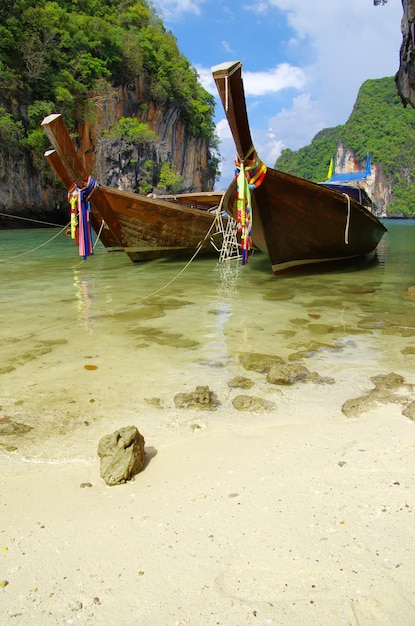 Tropical beach longtail boats Andaman Sea Thailand