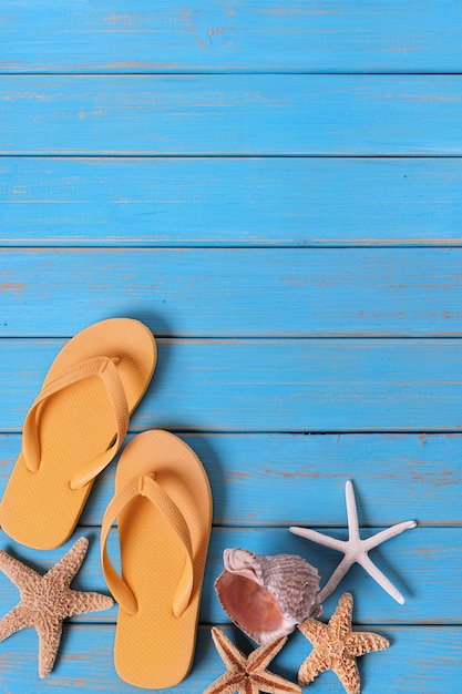 Tropical beach summer flip flops starfish background border vertical