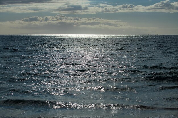 Tropical blue ocean in Hawaii. Summer sea in clean and clear water from surface for background. Waves concept design.