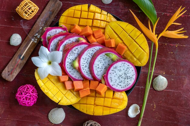 Tropical fruits assortment on a plate, close up