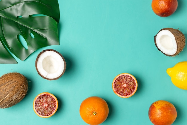 tropical fruits, blood oranges, coconut, palm leaf