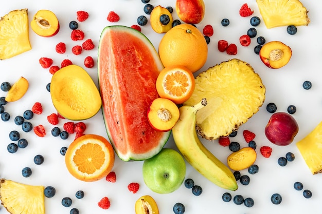 Tropical fruits on a white background top view