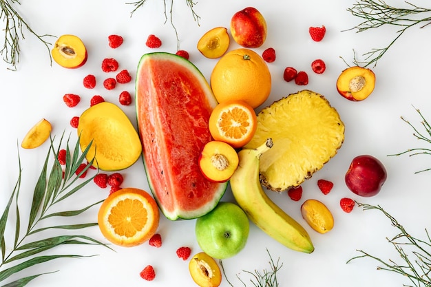 Tropical fruits on a white background top view