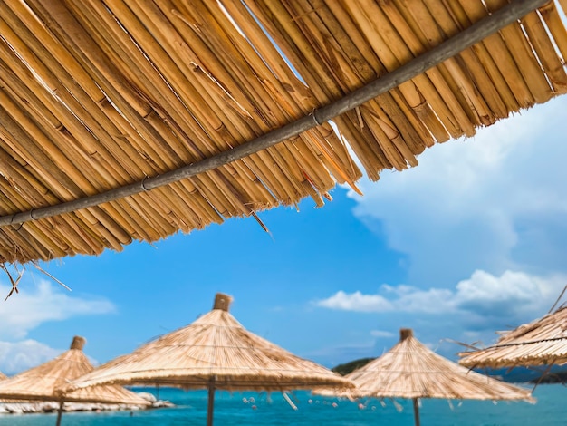 Tropical Getaway Unwind and Relax under the Sun Island sunshade umbrella against the blue sky Tropical paradise concept