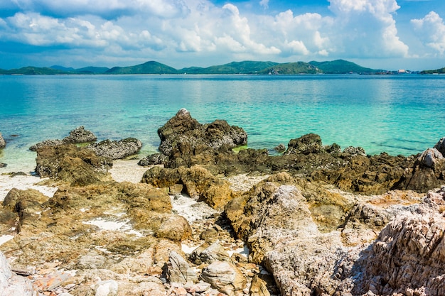 Tropical island rock on the beach with blue sky. Koh kham thailand