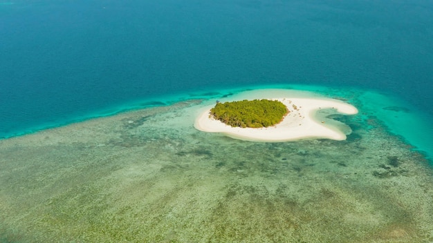 Tropical landscape small island with beautiful beach palm trees by turquoise water view from above p