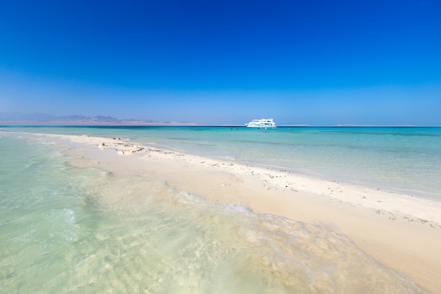 Tropical Maldives island with white sandy beach and sea