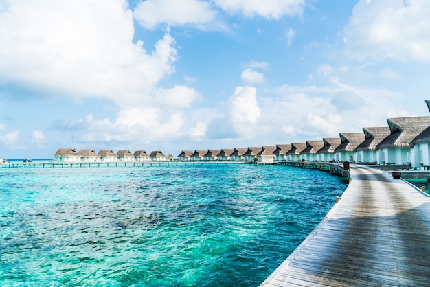 tropical Maldives resort hotel and island with beach and sea for holiday vacation concept