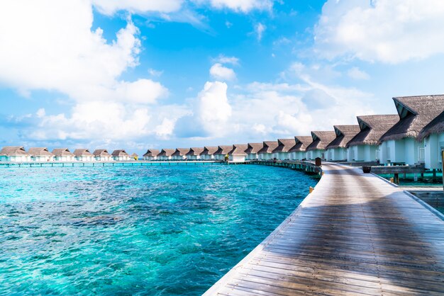 tropical Maldives resort hotel and island with beach and sea for holiday vacation concept