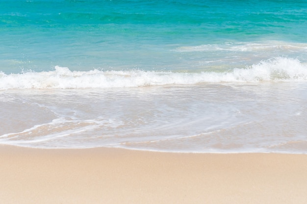 Tropical nature clean beach and white sand in summer with sun light blue sky and bokeh.