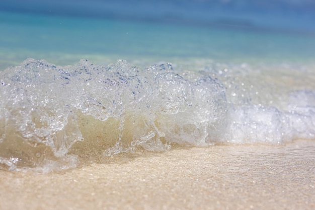 Tropical sea sand under the blue sky. Tropical beach landscape. Soft blue ocean wave, Mediterranean