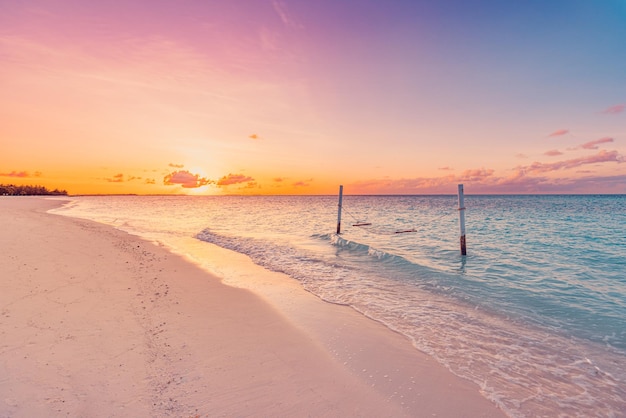 Tropical sunset beach and sky background as exotic summer landscape with beach swing hammock