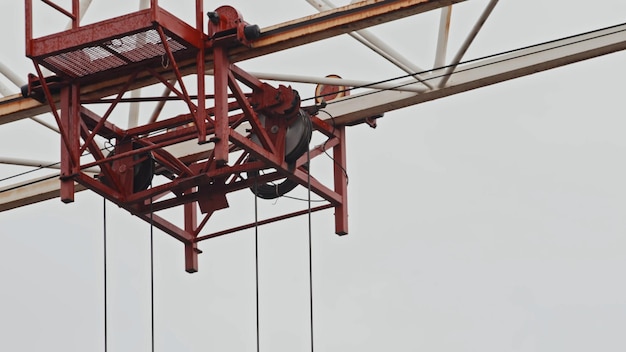 Truck construction tower crane traveling on the boom closeup