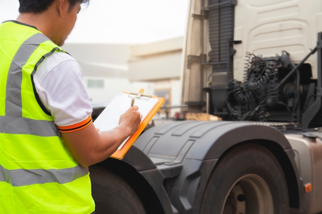 Truck driver inspecting safety daily checklist the semi truck