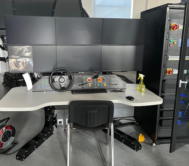 Truck driving simulator. View of computers setting the difficulty level of driving simulator