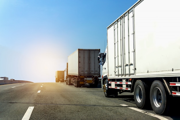 Truck on highway road with container,logistic industrial with blue sky