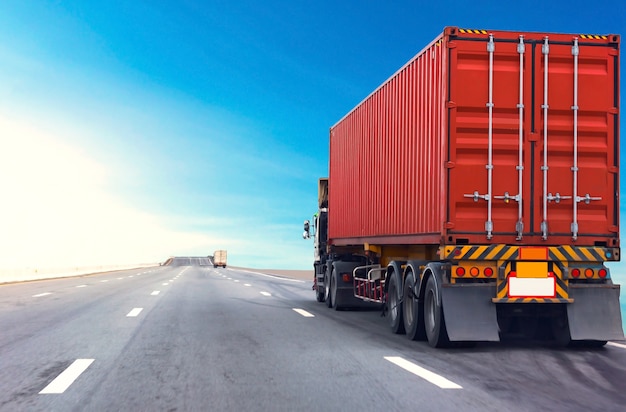 Truck on highway road with red container, transportation concept.,import,export logistic industrial Transporting Land transport on the asphalt expressway with blue sky