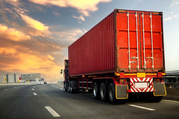 Truck on highway road with red container, transportation concept.,import,export logistic industrial Transporting