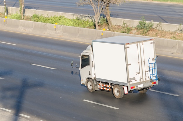 Truck running on the road, small truck on the road.