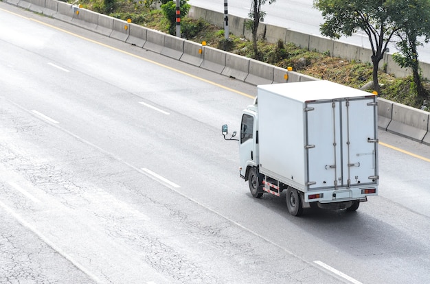 Truck running on the road, small truck on the road.