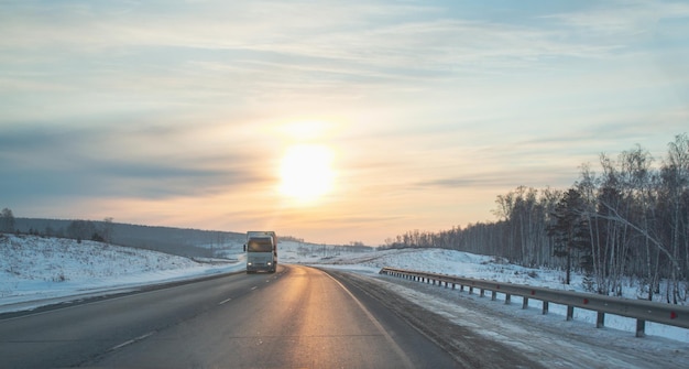 Truck on a suburban highway at sunset in spring Logistics cargo transportation