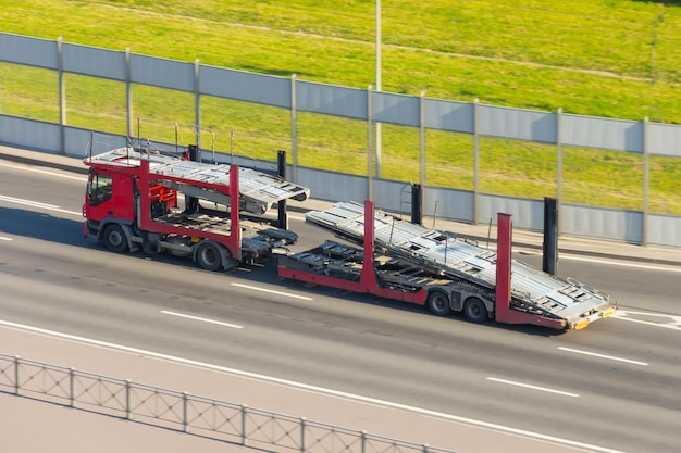 Truck with empty doubledeck trailer for transporting new cars