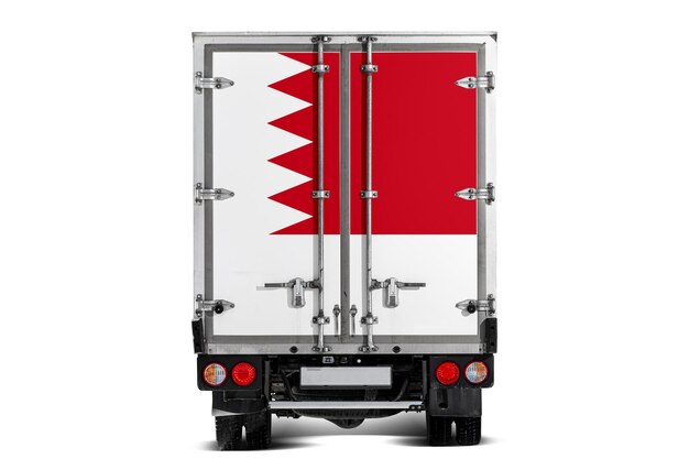 A truck with the national flag of Bahrain depicted on the tailgate drives against a white background Concept of exportimport transportation national delivery of goods