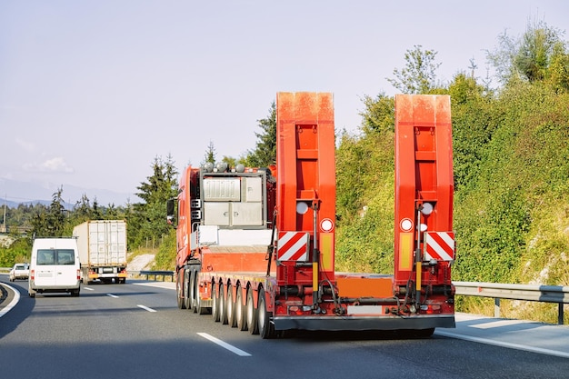 Truck without trailer box at the highway asphalt road of Poland. Truck transporter