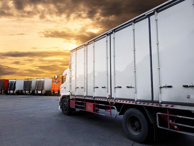 Trucks container parking with sunset sky