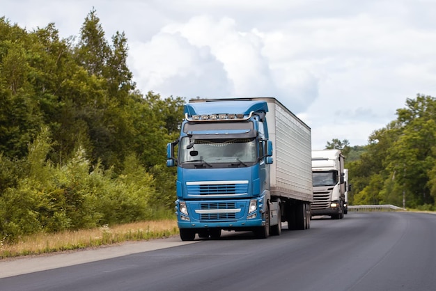 Trucks on a road in summer