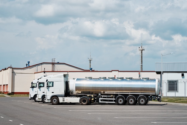 Trucks with tank trailer on parking lot