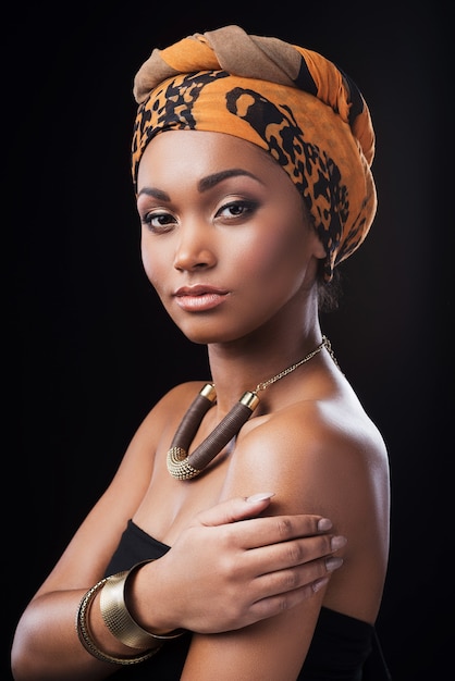 True African beauty. Beautiful African woman wearing a headscarf and looking at camera 