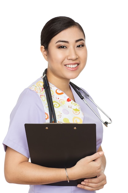 True professional. Vertical studio shot of a cheerful Asian female doctor