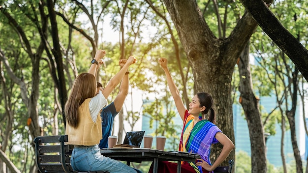 Trust partnershipYoung happy friend partner people Trust cheerful hands up Successful group team work Diverse LGBTQ culture students celebrating together Group of people supporting each others